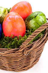 Image showing Basket of brightly coloured Easter Eggs