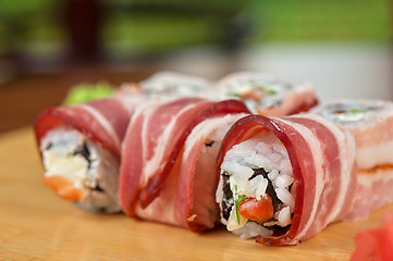 Image showing Sushi roll with bacon