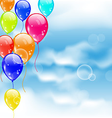 Image showing Flying colourful balloons in blue sky