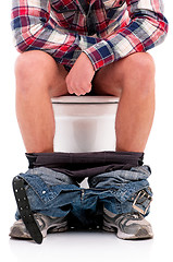 Image showing Man on toilet bowl