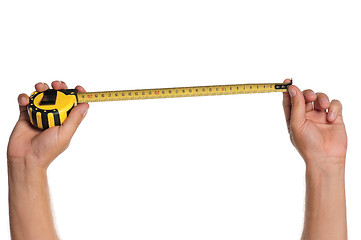 Image showing Hand with tape measure