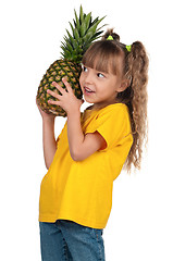 Image showing Little girl with pineapple