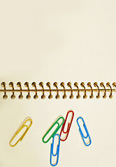 Image showing paper clips office in an empty notebook