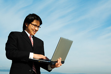 Image showing Businessman and laptop