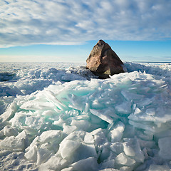 Image showing Big stone in the ice on the Baltic Sea coas