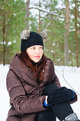 Image showing Portrait of the charming young woman in winter outdoors