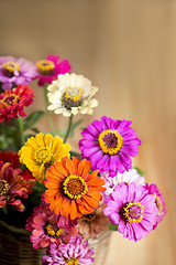 Image showing bouquet of beautiful wild flowers in a wattled basket