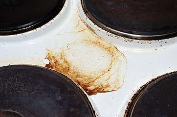 Image showing old white enamelled dirty electric cooker