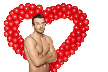 Image showing Shirtless man standing at heart shape background