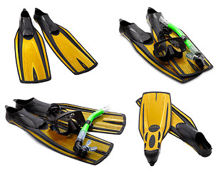 Image showing Set of yellow flippers, mask, snorkel for diving with water drop