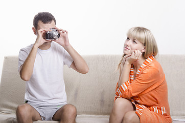 Image showing Guy photographed her sitting on the couch