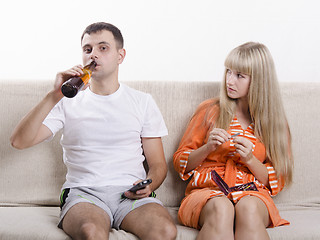 Image showing He drinking beer, she looks at him reproachfully