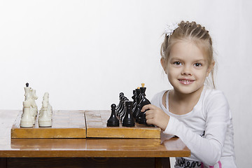 Image showing Four-year-old girl learns to play chess