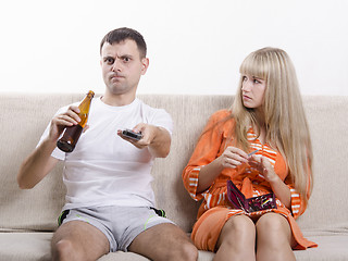 Image showing He drinking beer, she looks at him reproachfully