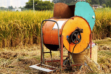 Image showing Vintage rice wood machine 