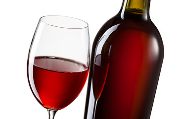 Image showing Glass of red wine and bottle isolated on white