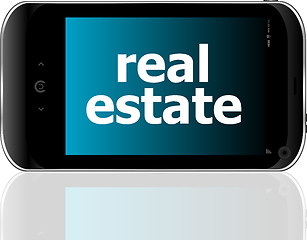 Image showing digital smartphone with real estate words, business concept