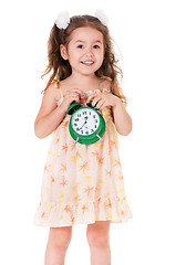 Image showing Girl with alarm clock