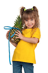 Image showing Little girl with pineapple