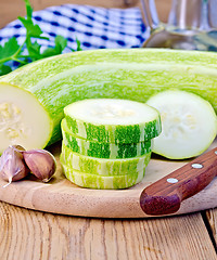 Image showing Zucchini green with garlic on a board