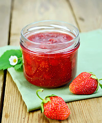 Image showing Jam of strawberry with berries on a board