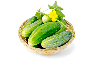 Image showing Cucumber with flower in a wicker basket