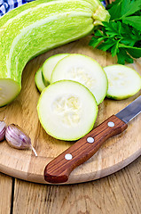 Image showing Zucchini green with knife on board