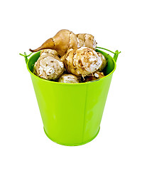 Image showing Jerusalem artichokes in a green bucket