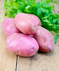 Image showing Potatoes red with parsley on the board