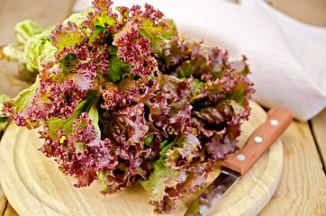 Image showing Lettuce red with a knife on board