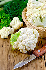 Image showing Cauliflower with a basket and knife on board