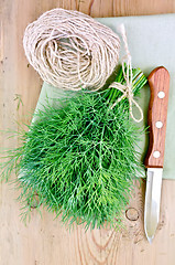 Image showing Dill with a knife and twine on the board