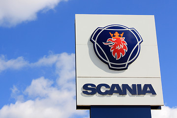 Image showing Sign Scania against Blue Sky with Some Clouds