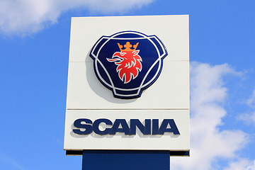 Image showing Sign Scania against Blue Sky with Some Clouds