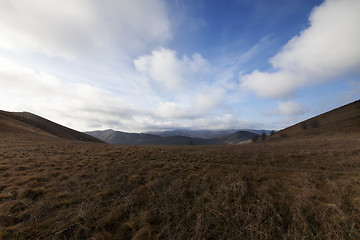 Image showing Steppe mountains and blue sky with clouds