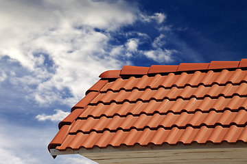 Image showing Roof tiles and sky with clouds at sunny day