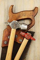 Image showing two hammer and old saw 