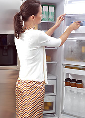 Image showing woman looking for something to eat