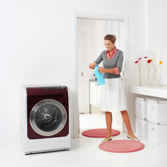 Image showing woman doing a housework holding presoak 