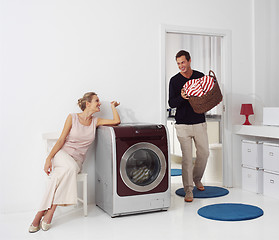 Image showing woman and man doing laundry