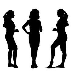 Image showing Black silhouettes of beautiful womans on white background. Vecto