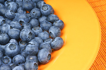 Image showing Blueberries in an orange plate