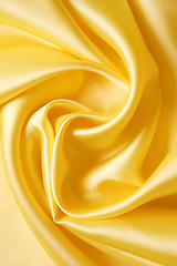 Image showing Smooth elegant golden silk as background 