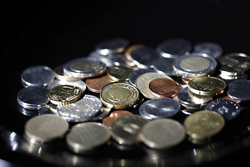 Image showing Coins on black