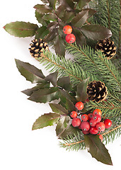 Image showing Christmas seasonal border of holly, mistletoe, sprigs with pine cones