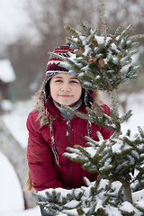 Image showing Portrait of a little girl and spruce