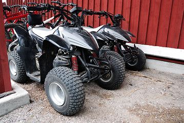 Image showing two ATVs outdoor near the house