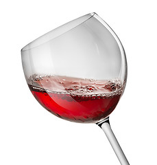 Image showing Moving red wine glass