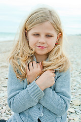 Image showing girl at the autumn beach 