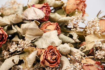 Image showing bouquet of dried roses with leaves